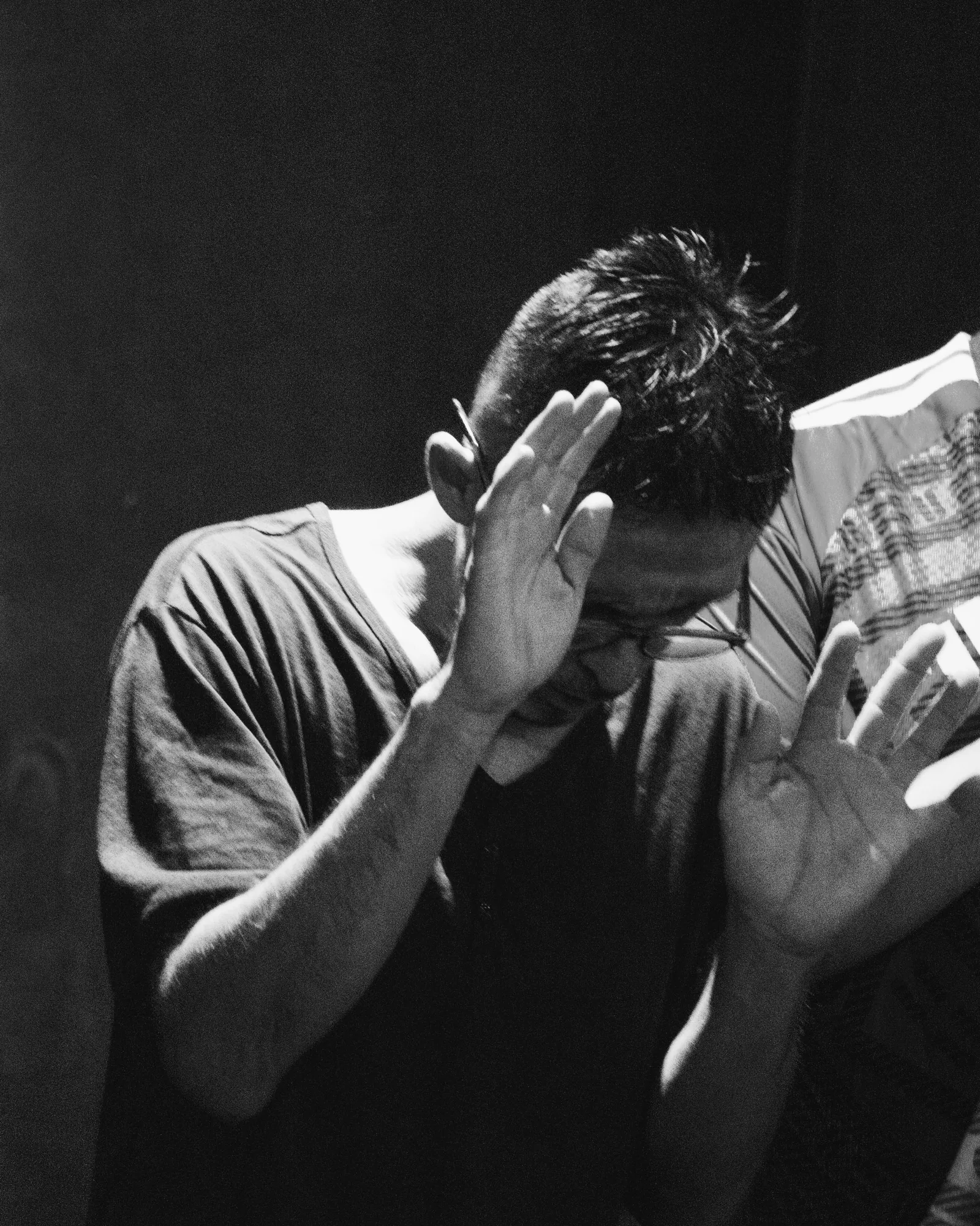 A man being prayed for